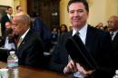 FBI Director Comey and Homeland Security Secretary Johnson are seated before a House Homeland Security hearing on Capitol Hill in Washington