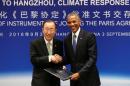 U.S. President Barack Obama and UN Secretary General Ban Ki-moon shake hands during a joint ratification, before the G20 Summit, in Hangzhou