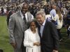 Los Angeles Dodgers owner Magic Johnson, left, Rachel Robinson, widow of baseball player Jackie Robinson, center, and actor Harrison Ford pose for photos during a Jackie Robinson Day ceremony before a baseball game against the San Diego Padres in Los Angeles, Monday, April 15, 2013. (AP Photo/Jae C. Hong)