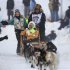 Lindner's team races down Cordova Street during the ceremonial start to the Iditarod dog sled race in downtown Anchorage, Alaska
