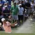 Tiger Woods watches his shot out of a bunker on the second hole during a practice round for the Masters golf tournament Tuesday, April 9, 2013, in Augusta, Ga. (AP Photo/Darron Cummings)