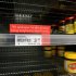 A sign alerting customers that a product is out of stock is placed in front of an empty shelve where Marmite is usually found at a supermarket in Auckland, New Zealand, Tuesday, March 20, 2012. The manufacturer, Sanitarium, announced this week it had run out of Marmite, the sticky black spread that fans adore and doubters think would be better used for axle grease. (AP Photo/New Zealand Herald, Sarah Ivey) NEW ZEALAND OUT, AUSTRALIA OUT