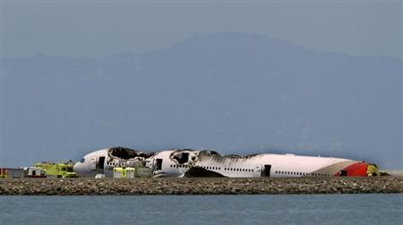 The wreckage of an Asiana Airlines Boeing 777 that crashed while landing at San Francisco International Airport is seen in San Francisco, California, July 6, 2013.