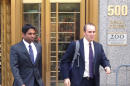 Rengan Rajaratnam, left, exits Manhattan federal court in New York with his attorney Daniel Gitner Tuesday, July 8, 2014 after he was acquitted of conspiracy to commit securities fraud. Prosecutors had alleged that Rajaratnam, 43, joined with his brother, Raj Rajaratnam, to cheat in the stock market in 2008 on the securities of two technology companies. (AP Photo/Larry Neumeister)
