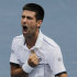 Novak Djokovic of Serbia reacts after winning a semifinal match against Roger Federer of Switzerland at the U.S. Open tennis tournament in New York, Saturday, Sept. 10, 2011. (AP Photo/Mike Groll)