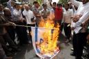 Iranians burn Israeli flags during a 2008 protest in Tehran