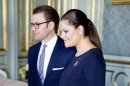 Sweden's Crown Princess Victoria, right, and Prince Daniel, left, arrive for a luncheon with Finland's president, not pictured, in Stockholm's Royal Palace on Tuesday Feb. 21, 2012. The crown princess is pregnant and the couple are expecting their first child in March 2012. (AP Photo/Pontus Lundahl) SWEDEN OUT