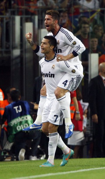 Real Madrid's Ronaldo celebrates with Ramos after scoring against Barcelona during their Spanish first division soccer match at Nou Camp stadium in Barcelona