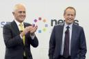 FILE - In this June 17, 2016, file photo, Australia's Prime Minister Malcolm Turnbull, left, and opposition leader Bill Shorten stand together at the end of a debate hosted by Facebook Australia and News.com.au in Sydney, Australia. Australians go to the polls Saturday, July 2, 2016, with the opposition leader vying to become the country's fifth prime minister in three years. (Lukas Coch/Pool Photo via AP)