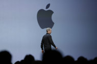 Apple CEO Tim Cook walks on stage to deliver the keynote address of the Apple Worldwide Developers Conference, Monday, June 10, 2013, in San Francisco. (AP Photo/Eric Risberg)