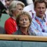 Swiss President Widmer-Schlumpf awaits the start of the men's singles tennis gold medal match between Britain's Murray and Switzerland's Federer at the All England Lawn Tennis Club during the London 2012 Olympic Games