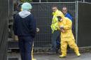 An expert wearing a protection suit arrives at a poultry farm, where a highly contagious strain of bird flu was found by Dutch authorities, in Hekendorp