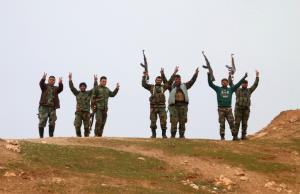 Syrian government forces raise their weapons as they&nbsp;&hellip;