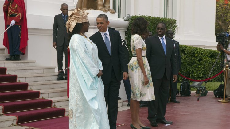 U.S. President Obama speaks to Senegalese First Lady Faye Sall as Senegalese President Sall chats with U.S. first lady Michelle at presidential palace in Dakar
