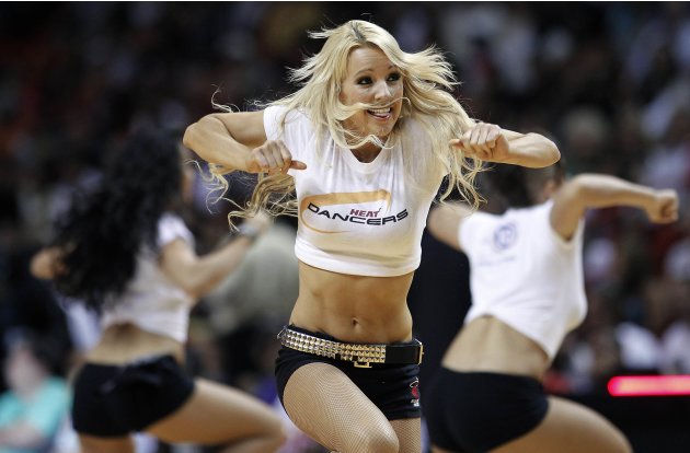 Miami Heat dancers perform during a time out against the Bulls in the first half of their NBA basketball game in Miami