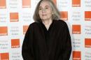 FILE - In this June 3, 2009 file photo, author Marilynne Robinson poses for the photographers prior to the ceremony for the 2009 Orange Book prize for fiction in London's Royal Festival Hall. Robinson, cartoonist Roz Chast and former U.S. poet laureate Louise Glueck are among this year's finalists for the National Book Awards. Robinson was cited for 