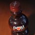 A photo illustration of a bottle of POM Wonderful pomegranate juice