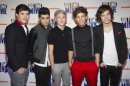 FILE - In this March 8, 2012 file photo, members of the band One Direction, from left, Liam Payne, Zayn Malik, Niall Horan, Louis Tomlinson and Harry Styles attend the premiere of the Nickelodeon TV movie 