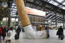 FILE - In this Dec.4, 2012 file photo, a sculpture of a cigarette butt is set up inside Gare de Lyon railway station, in Paris. Too-thin models, too much drinking, sexy cigarette packs _ France’s Parliament is cracking down on all of this in a sweeping law designed to trim public health costs, and is tackling unhealthy stereotypes along the way. (AP Photo/Remy de la Mauviniere, File)