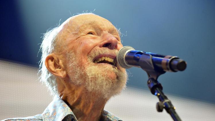 File-This Sept. 21, 2013, file photo shows Pete Seeger performing on stage during the Farm Aid 2013 concert at Saratoga Performing Arts Center in Saratoga Springs, N.Y. The American troubadour, folk singer and activist Seeger died Monday Jan. 27, 2014, at age 94. (AP Photo/Hans Pennink, File)
