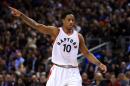 DeMar DeRozan of the Toronto Raptors signals to teammates during the first half of an NBA game against the Cleveland Cavaliers at Air Canada Centre on December 5, 2016