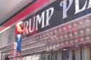 In this photo taken Oct. 6, 2014, a worker removes the "Trump" name from the Trump Plaza casino in Atlantic City, N.J. A bankruptcy court judge sided with Donald and Ivanka Trump on Friday, Feb. 20, 2015, ruling that they can move forward with a lawsuit seeking to strip the family name from Atlantic City's Taj Mahal casino. Trump Entertainment Resorts, with which Donald Trump is no longer affiliated, has stripped the Trump name from most of Trump Plaza, which closed on Sept. 16, but is fighting to be able to use it at the Taj Mahal, its lone remaining casino. (AP Photo/Wayne Parry)