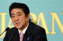 Japan's Liberal Democratic Party leader Abe speaks during a political debate in Tokyo