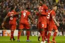 Liverpool's striker Christian Benteke (2R) celebrates after scoring during a UEFA Europa League group B football match against Bordeaux at Anfield in Liverpool on November 26, 2015