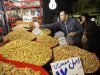 In this Thursday, Feb. 2, 2012 photo, an Iranian vendor sells pistachio in Tehran's old main bazaar, Iran. A simple trip the store these days offers a crash course in life under sanctions. The price tags on many imported goods from South Korean refrigerators to Turkish crackers are sometimes double from last year. The money to buy them, meanwhile, has plunged in value against the U.S. dollar and other foreign currencies. (AP Photo/Vahid Salemi)