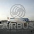 An A380 aircraft is seen through a window with an Airbus logo during the EADS / Airbus 'New Year Press Conference' in Hamburg