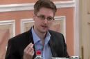 FILE - In this file image made from video released by WikiLeaks on Friday, Oct. 11, 2013, former National Security Agency systems analyst Edward Snowden speaks during a presentation ceremony for the Sam Adams Award in Moscow, Russia. In an interview with the New York Times posted to its website on Thursday, Oct. 17, 2013, Snowden says that he did not take any secret NSA documents to Russia and that intelligence officials in China as well as Russia could not get access to the documents he had obtained before leaving the United States. (AP File Photo)