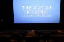 People watch "The Act of Killing" movie in Jakarta