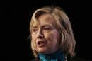 Former Secretary of State Hillary Rodham Clinton speaks to the National Automobile Dealers Association meeting in New Orleans, Monday, Jan. 27, 2014. (AP Photo/Gerald Herbert)