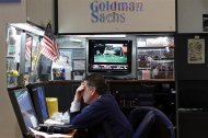 A trader works in the Goldman Sachs booth on the main trading floor of the New York Stock Exchange July 29, 2011.   REUTERS/Mike Segar