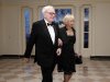 FILE - In this March 14, 2012 file photo, Warren Buffett and Astrid M. Buffett arrive at the Booksellers area of the White House in Washington for the State Dinner hosted by President Barack Obama and first lady Michelle Obama for British Prime Minister David Cameron and his wife Samantha. A bill designed to enact President Barack Obama's plan for a "Buffett rule" tax on the wealthy would rake in just $31 billion over the next 11 years, according to an estimate by Congress' official tax analysts obtained by The Associated Press. (AP Photo/Charles Dharapak, File)