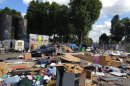 This is an image taken Thursday, Aug. 9, 2012 of the abandoned lot that Gypsies had made their home for five months in Gennevilliers, outside Paris, shortly after they learned the encampment would be demolished. The Gypsy camps lack electricity and running water. Grocery carts become makeshift grills. Rats run rampant and fleas gnaw on young and old alike. It's a life that modernity has bypassed, compounded by a dismal economy that has stretched from their homeland in Romania to a France that wants them to go somewhere anywhere else. (AP Photo/ Lori Hinnant )