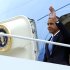 President Barack Obama waves as he arrives on Air Force One at John F. Kennedy International Airport, Tuesday, Sept. 18, 2012, in New York.  (AP Photo/Carolyn Kaster)