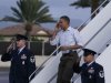 President Barack Obama salutes as he steps off of Air Force One at Hickam Air Force Base in Friday, Dec. 23, 2011, in Honolulu. (AP Photo/Carolyn Kaster)