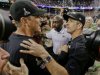 San Francisco 49ers head coach Jim Harbaugh, left, greets Baltimore Ravens head coach John Harbaugh after the Ravens defeated the 49ers 34-31 in the NFL Super Bowl XLVII football game, Sunday, Feb. 3, 2013, in New Orleans. (AP Photo/Dave Martin)