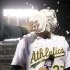 Oakland Athletics' Brandon Moss gets a shaving cream pie to the face as he conducts an interview after his game winning two-run home run against the Los Angeles Angels during a baseball game on Tuesday, April 30, 2013 in Oakland. Calif. Oakland won 10-8 in 19 innings.  (AP Photo/Marcio Jose Sanchez)