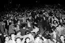 FILE - In this Nov. 30, 1947 file photo, Jewish people gather in the streets of Tel Aviv, many dancing after the United Nations announcement for a plan of the partition of Palestine and the new Jewish state.(AP Photo/Jim Pringle, File)
