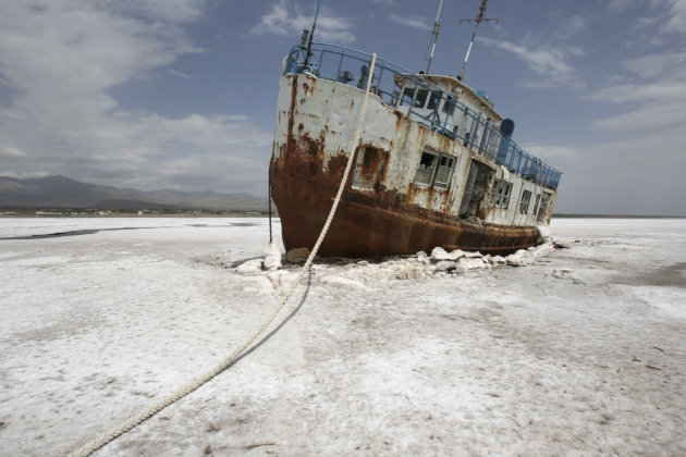 FILE - In this Friday, April 29, 2011 file photo, an abandoned ship is stuck in the solidified salts of the Oroumieh Lake, Iran. Protesters demanding greater environmental protections for one of the w