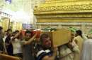 Mourners carry the coffin of a victim killed during an attack on a prison in Taji, during a funeral in Najaf