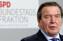 Former German Chancellor Schroeder addresses a news conference following a SPD parliamentary faction meeting