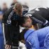 Raul Meireles and John Terry of Chelsea look at their injured team mate Ramires during their FA Cup soccer match against Queens Park Rangers at Loftus Road in London