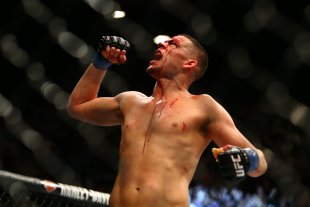 Nate Diaz celebrates after defeating Conor McGregor at UFC 196. (Getty)