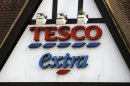 A sign of Tesco supermarket is seen at a branch in Purley, south London, Wednesday, Jan. 16, 2013. The Irish food safety watchdog said Tuesday that it had discovered traces of horse and pig DNA in burger products sold by some of the country's biggest supermarkets. Tesco that authorities said was made of roughly 30 percent horse. Tesco, the country's biggest supermarket chain, took out full-page newspaper ads Thursday Jan. 17, 2013 to apologize for an unwanted ingredient in some of its hamburgers: horsemeat. Ten million burgers have been taken off shop shelves after the revelation that beef products from three companies in Ireland and Britain contained horse DNA. Most had only small traces, but one type of burger sold by Tesco was 29 percent horse. The contrite grocer told customers that "we and our supplier have let you down and we apologize." (AP Photo/Sang Tan)