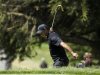 Tiger Woods of the U.S. reacts after hitting from the edge of a bunker on the sixth green during the second round of the 2012 U.S. Open golf tournament on the Lake Course at the Olympic Club in San Francisco