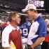 Washington Redskins head coach Mike Shanahan, left, talks with Indianapolis Colts quarterback Peyton Manning following an NFL preseason football game in Indianapolis, on Friday, Aug. 19, 2011. Washington won 16-3.  (AP Photo/Michael Conroy)