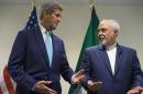 FILE - In this Sept. 26, 2015 file photo, Secretary of State John Kerry meets with Iranian Foreign Minister Mohammad Javad Zarif at United Nations headquarters. As Iran races to satisfy the terms of last summer's nuclear deal and the U.S. prepares to suspend sanctions on Tehran as early as Friday, Kerry is talking to Zarif more than any other foreign leader, including an emergency call Tuesday to secure the release of 10 U.S. sailors after they were detained by Iran in the Persian Gulf. (AP Photo/Craig Ruttle, File)